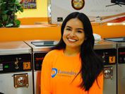 Image of a smiling woman at a Speed Queen laundromat