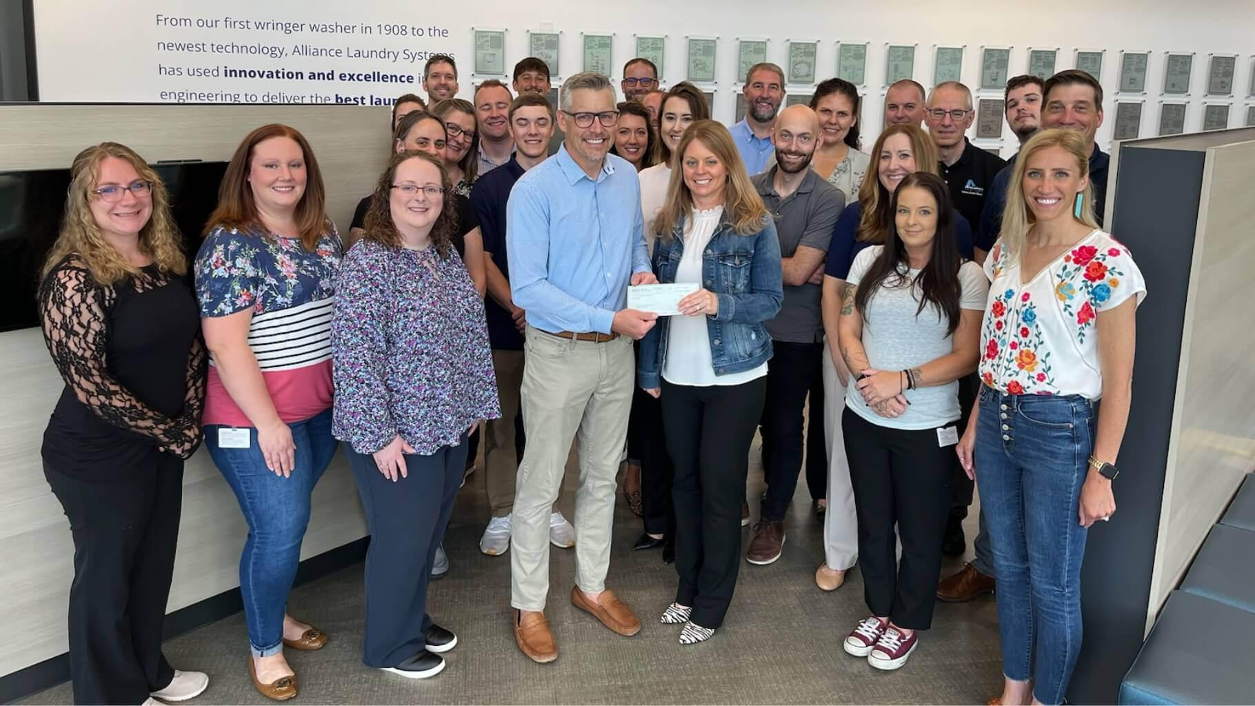 Alliance Laundry Systems corporate employees pose in Ripon office