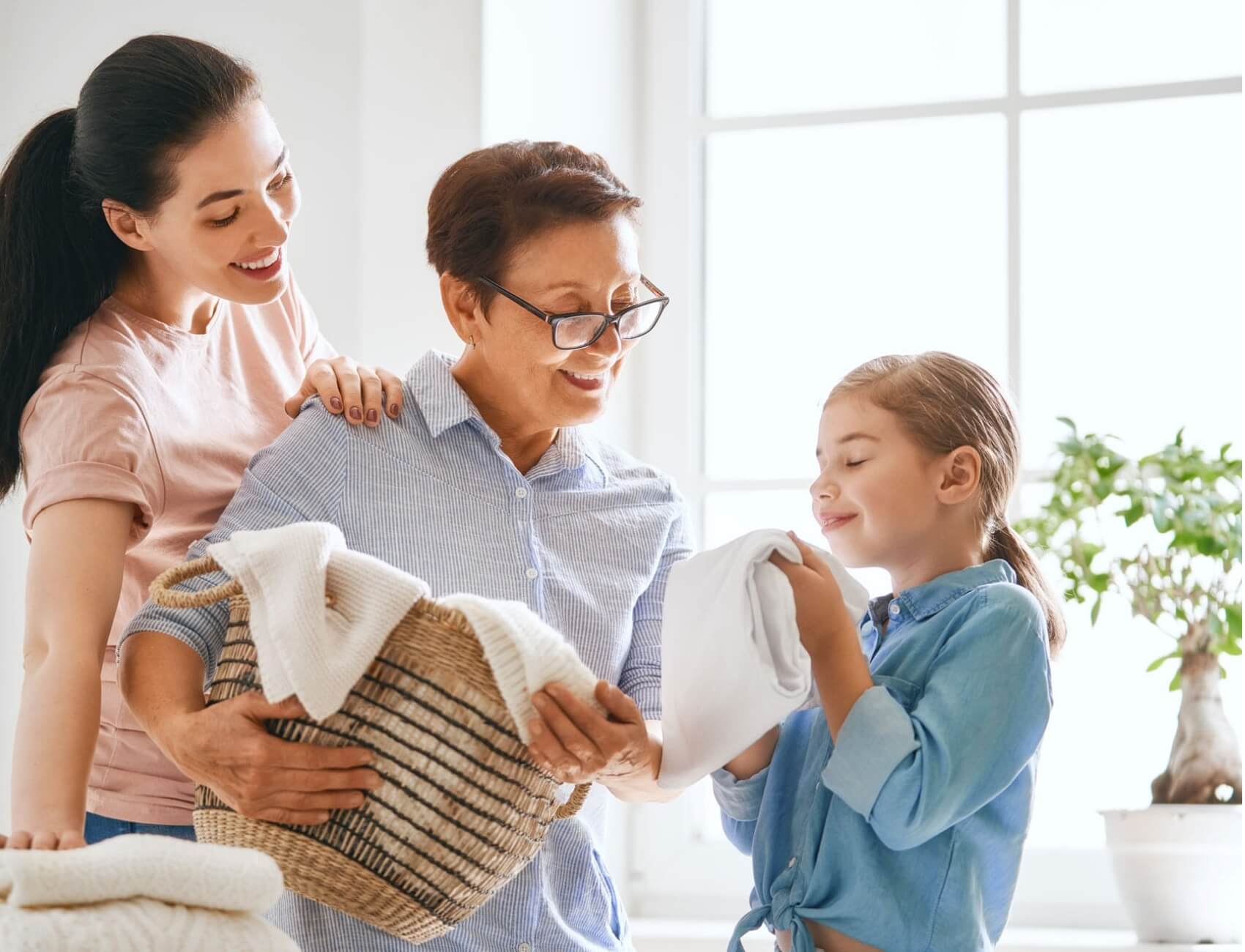 Women and children folding laundry