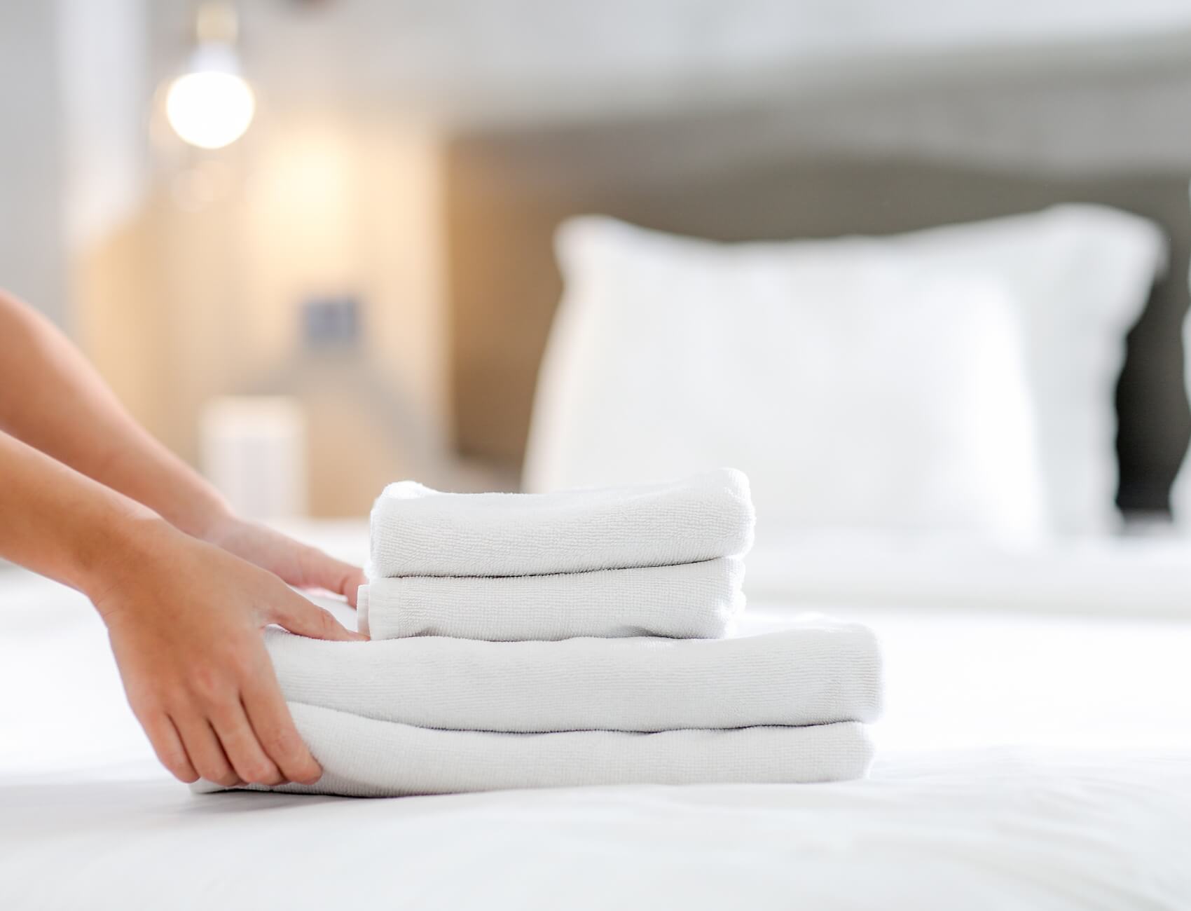 Clean laundry on hotel bed