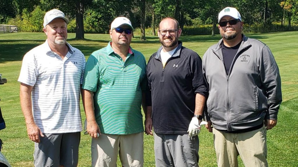 Four men standing at Alliance Laundry Systems annual golf fundraiser