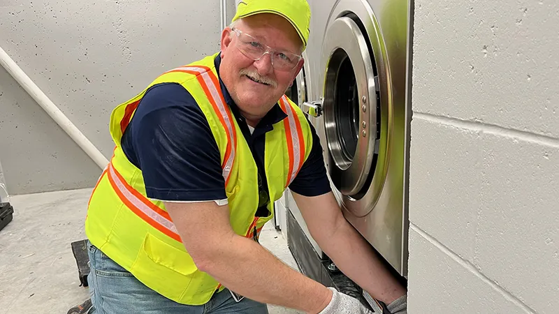 Alliance volunteer installing equipment