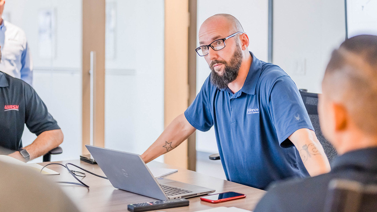 Alliance Laundry Systems salesperson with laptop