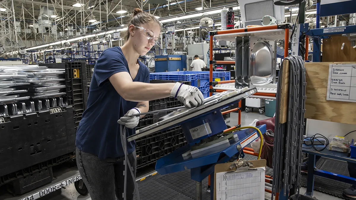Young employee working on plant floor