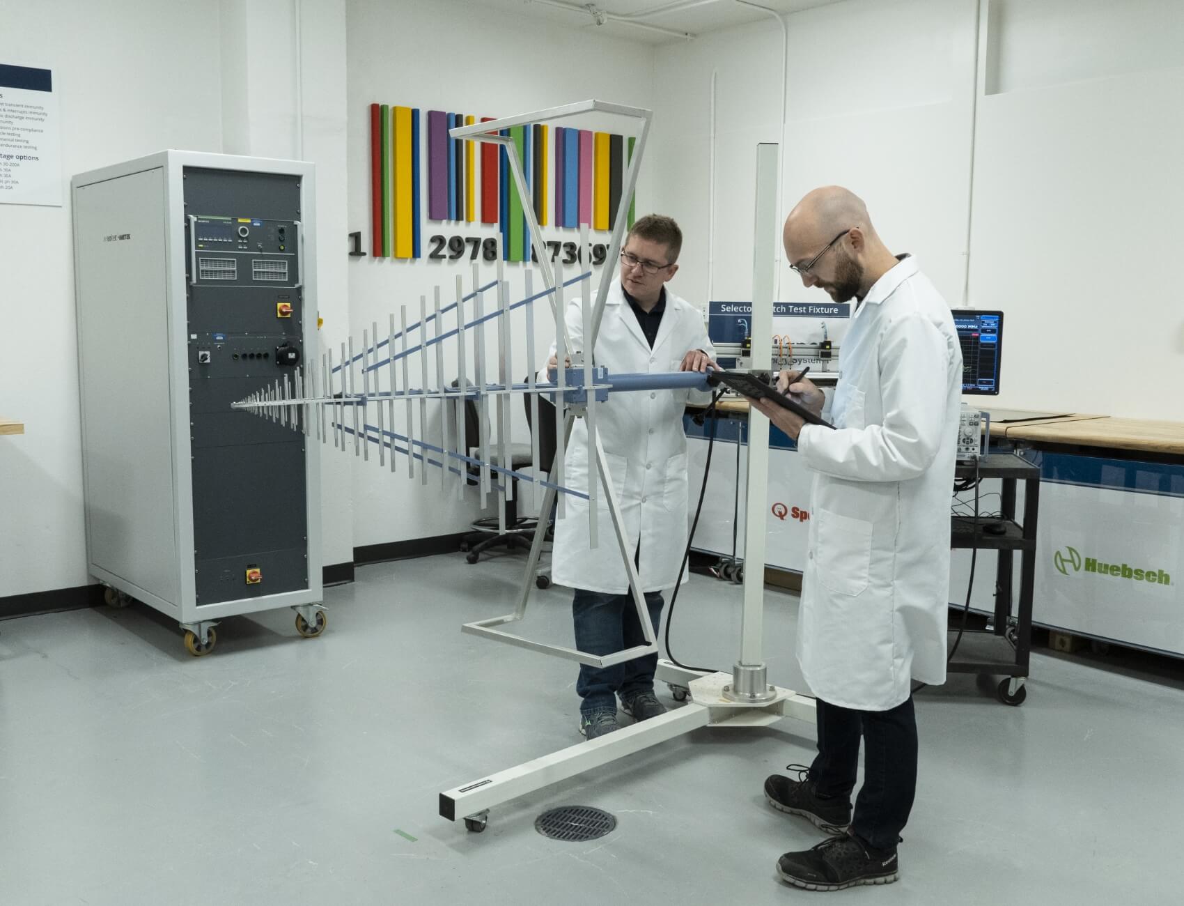 how-we-do-it two employees in lab coats working together