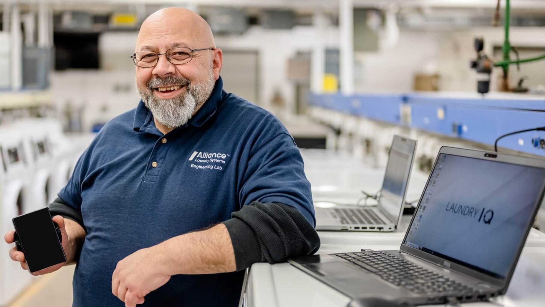 Smiling employee in Alliance Engineering Lab