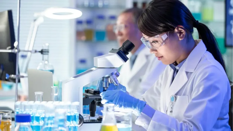 Scientist working with microscope at STAR center